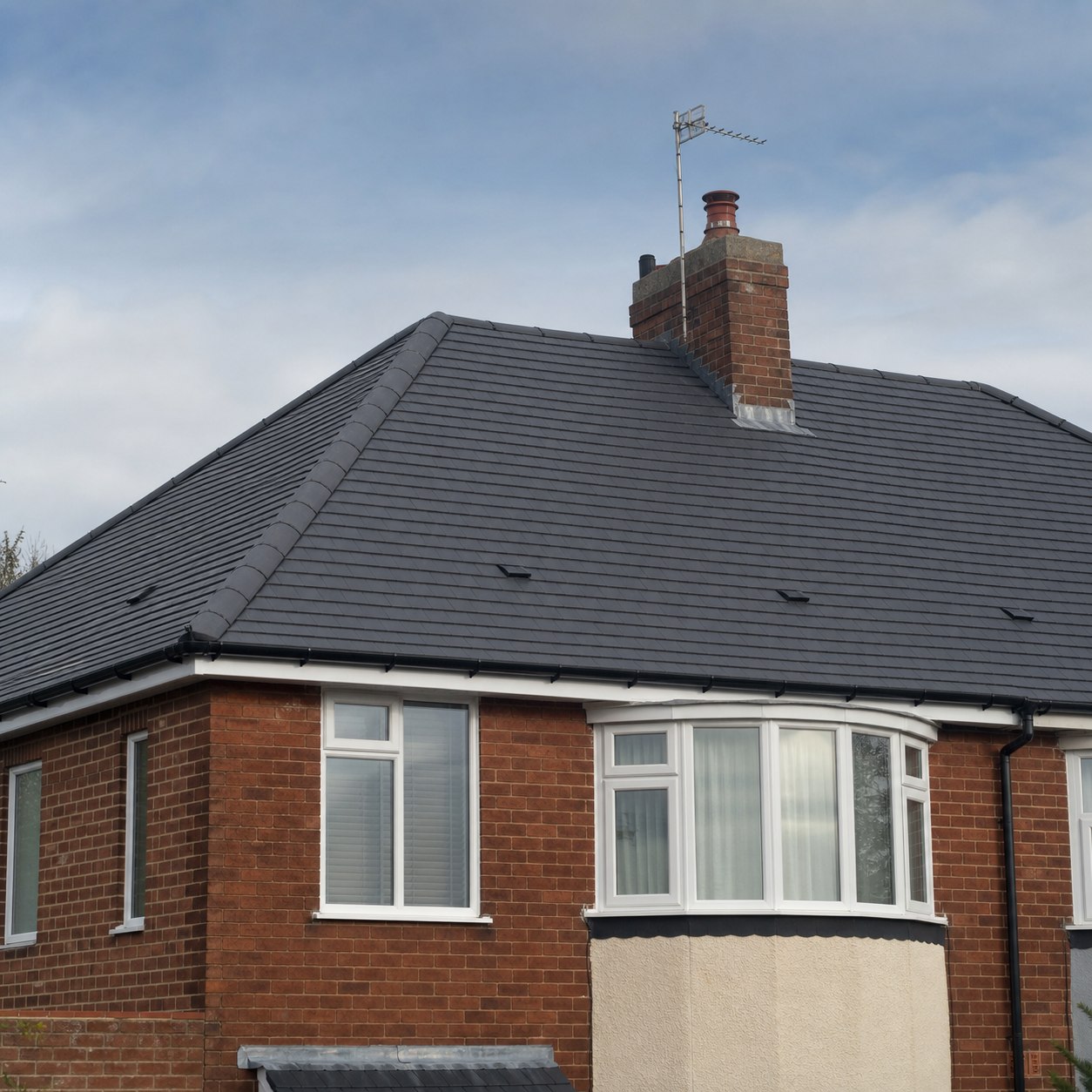 New clay tiled roof on a brick home